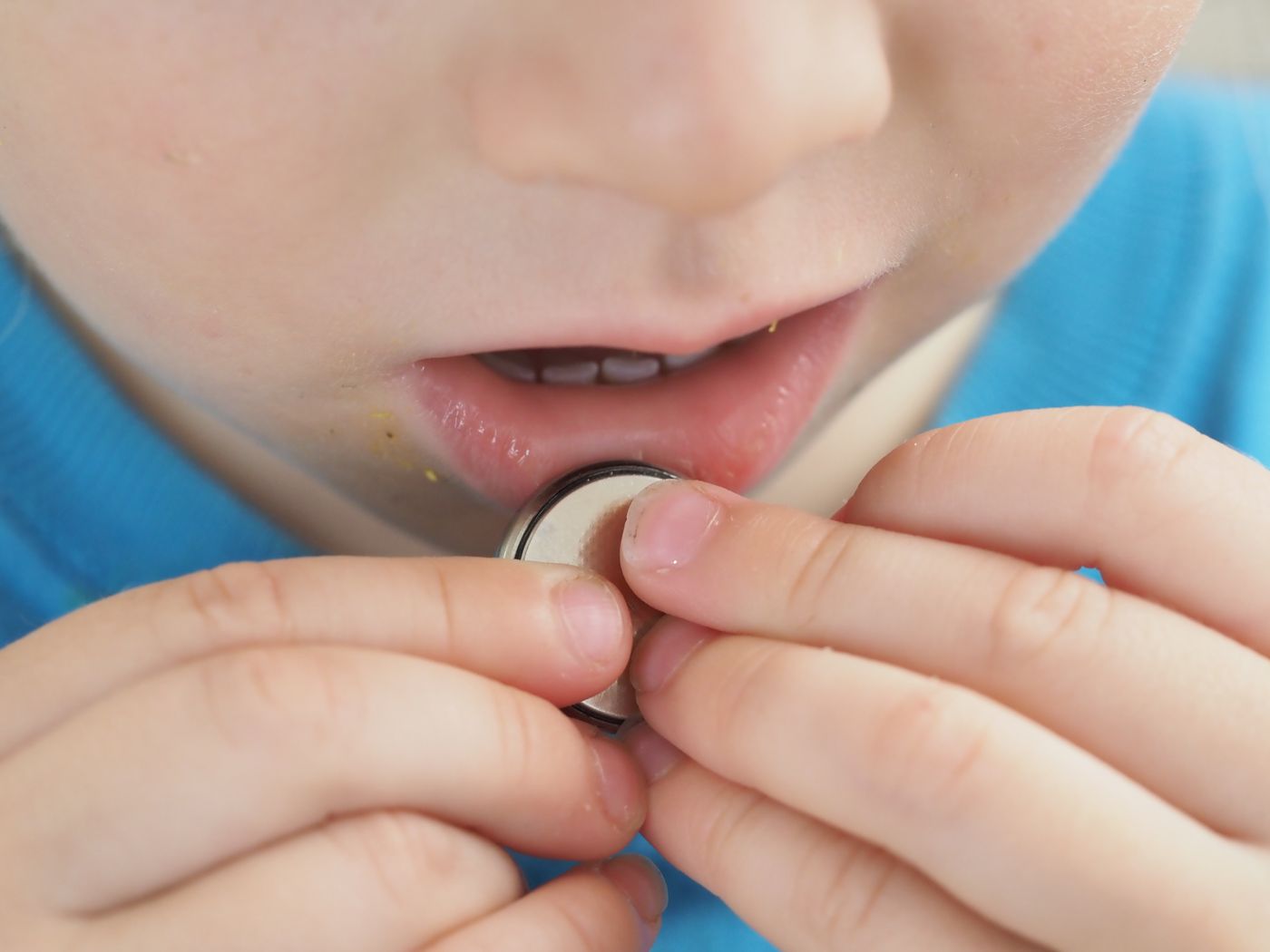 Button battery safe swallow children QTC coating