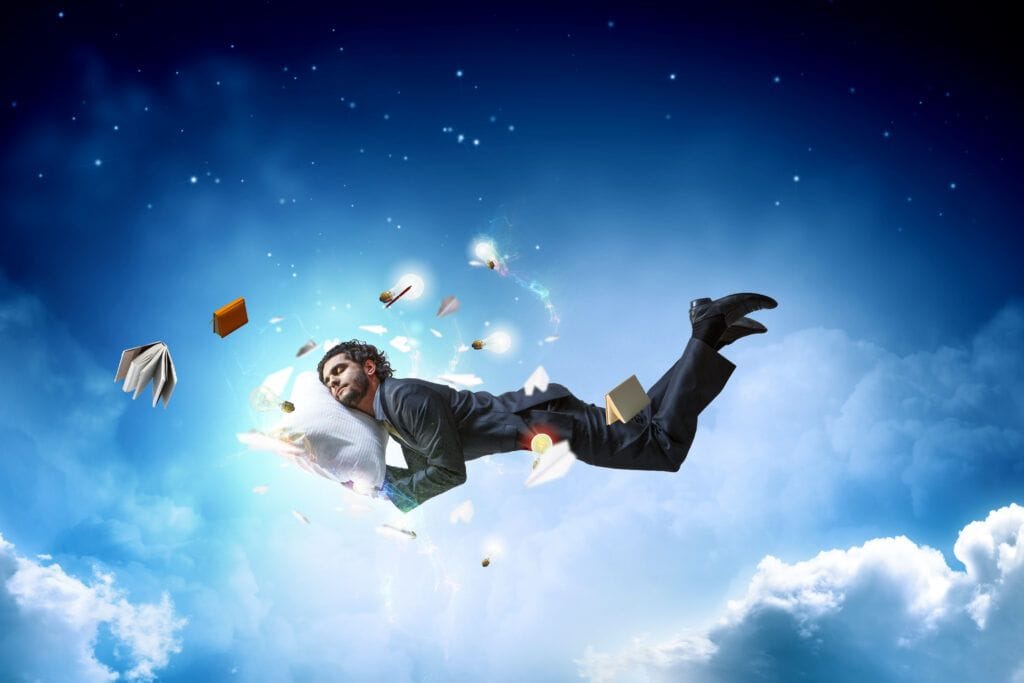 Person in a dreamy state with eyes open, illustrating the brain's ability to dream while awake