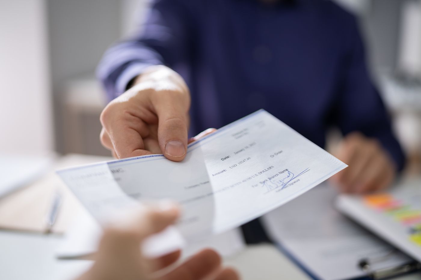 Handing a check