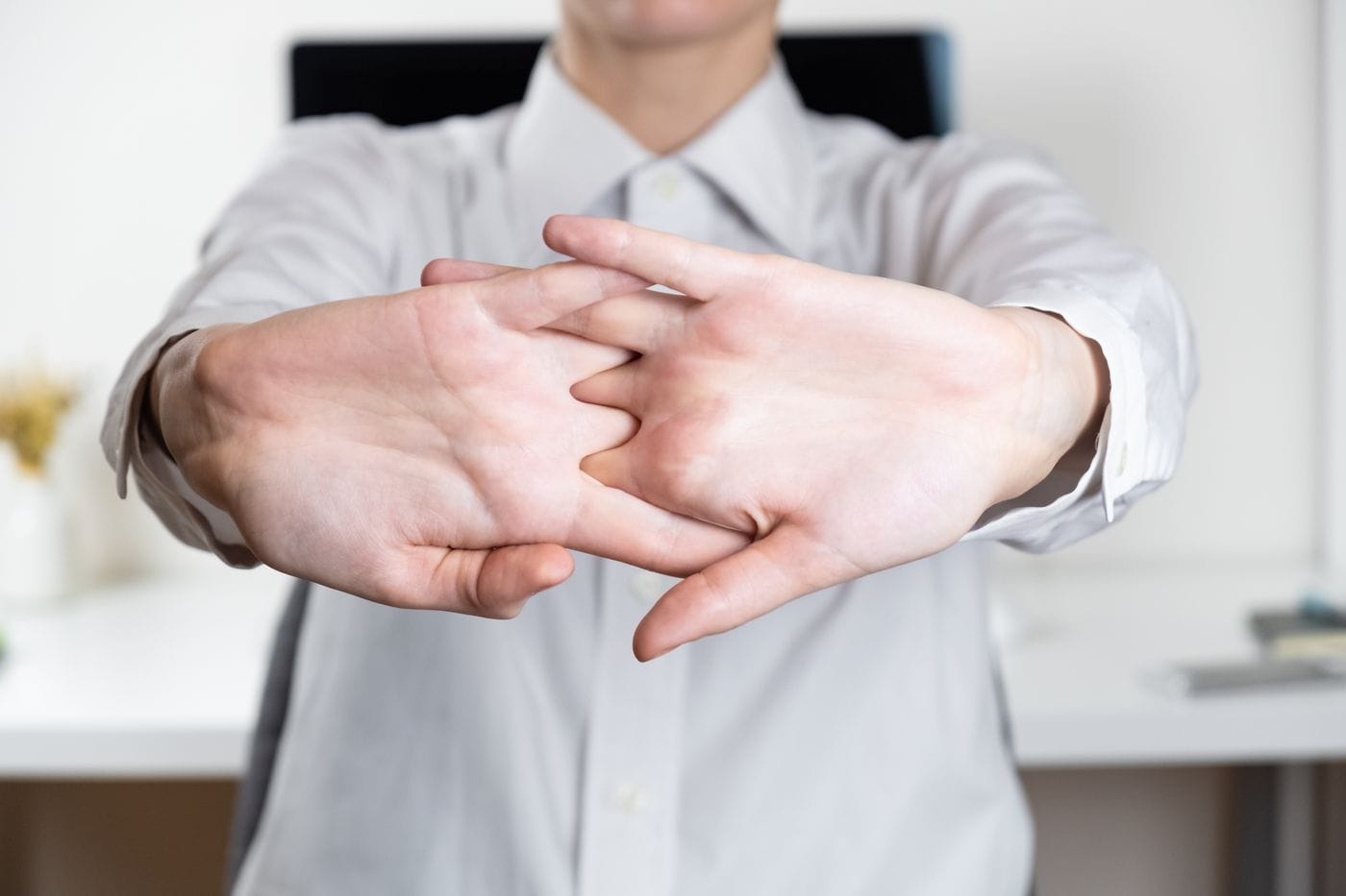 Close-up of a hand cracking knuckles
