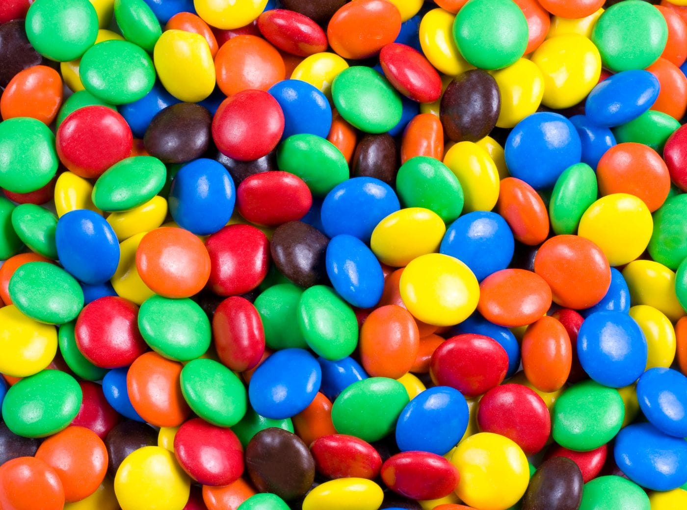 A bowl of colorful M&M's candies representing Mars launching artificial dye-free versions of M&M's in August 2026 without blue and brown as it transitions to natural ingredients like beets and turmeric