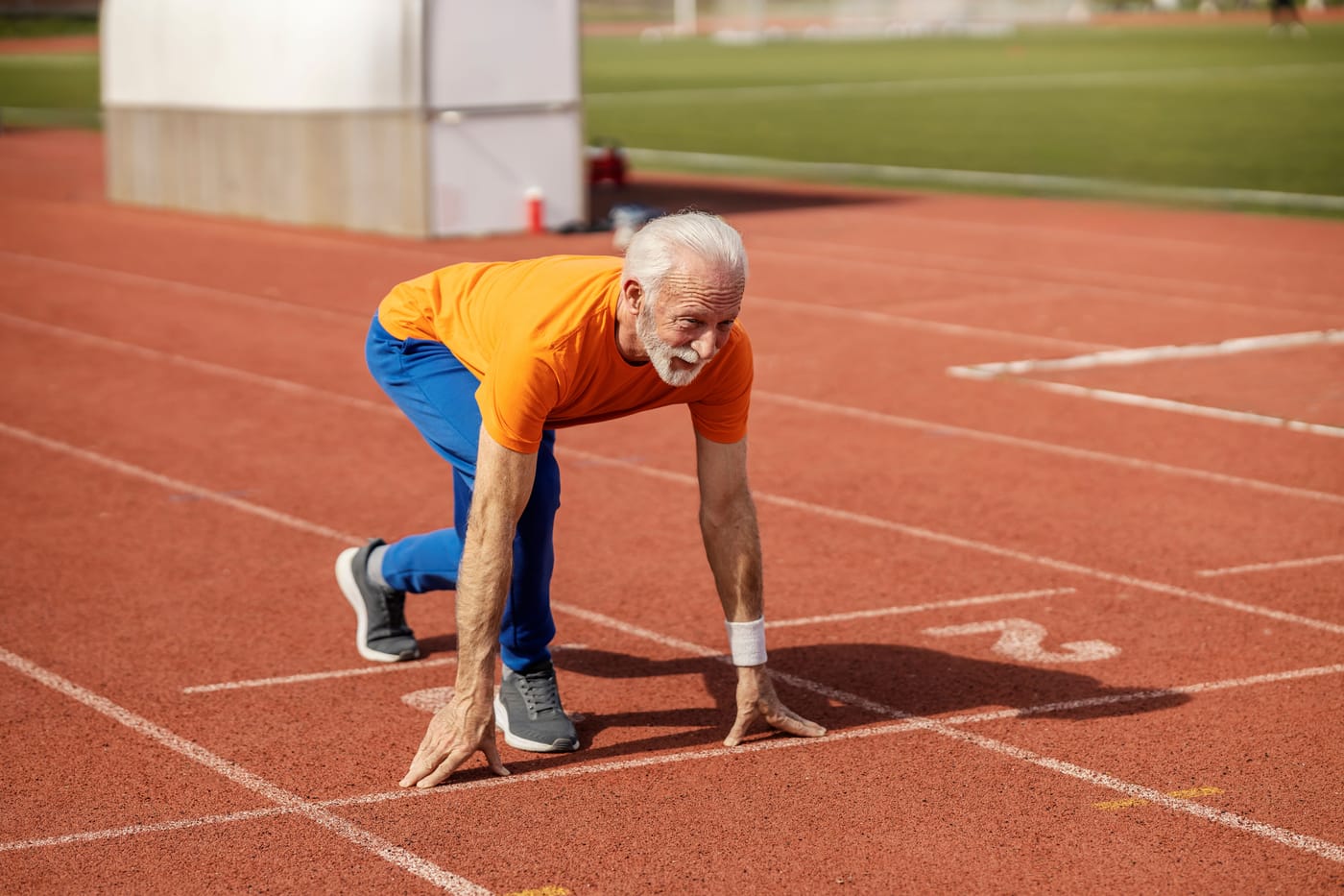 Older athlete running a race, proving age is just a number