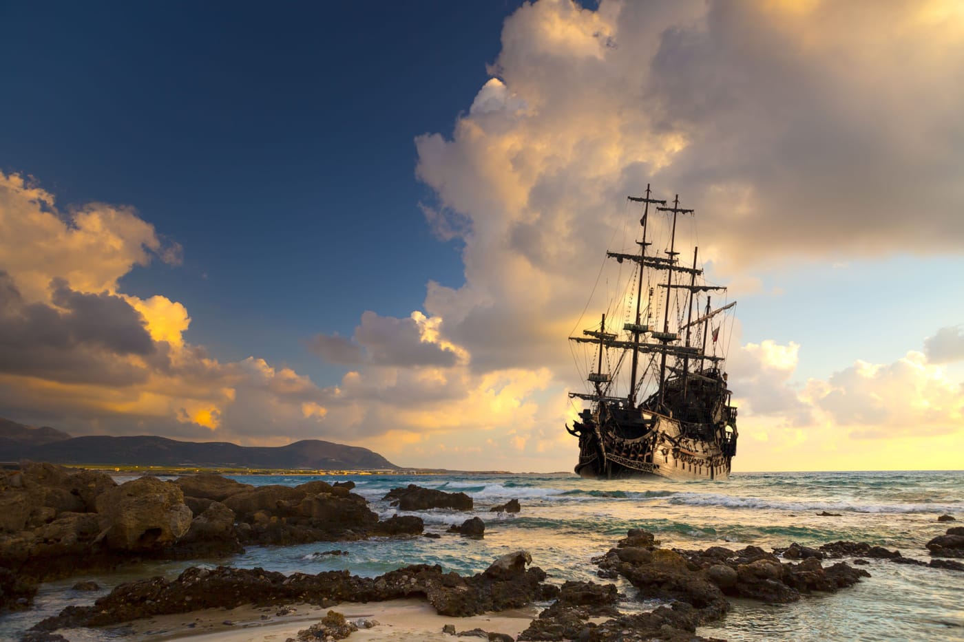 Diver filming the charred wooden hull of an 18th-century pirate era shipwreck in Nassau Harbour Bahamas discovered by the New Providence Pirates Expedition and Wreckwatch TV