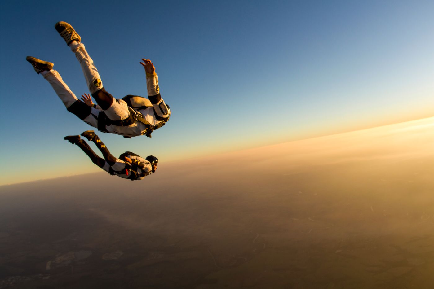Funky Matas tattooing himself during freefall at 15002 feet above Lake Wales Florida on June 8 2026 setting the Guinness World Record for highest altitude skydive whilst performing a self tattoo