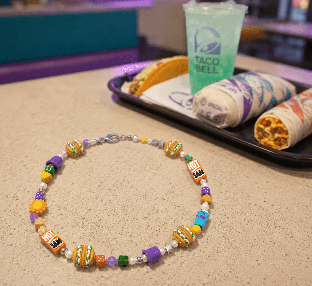 Taco Bell Ian Charms limited edition charm necklace free drop June 23 2026 Taco Bell app Rewards