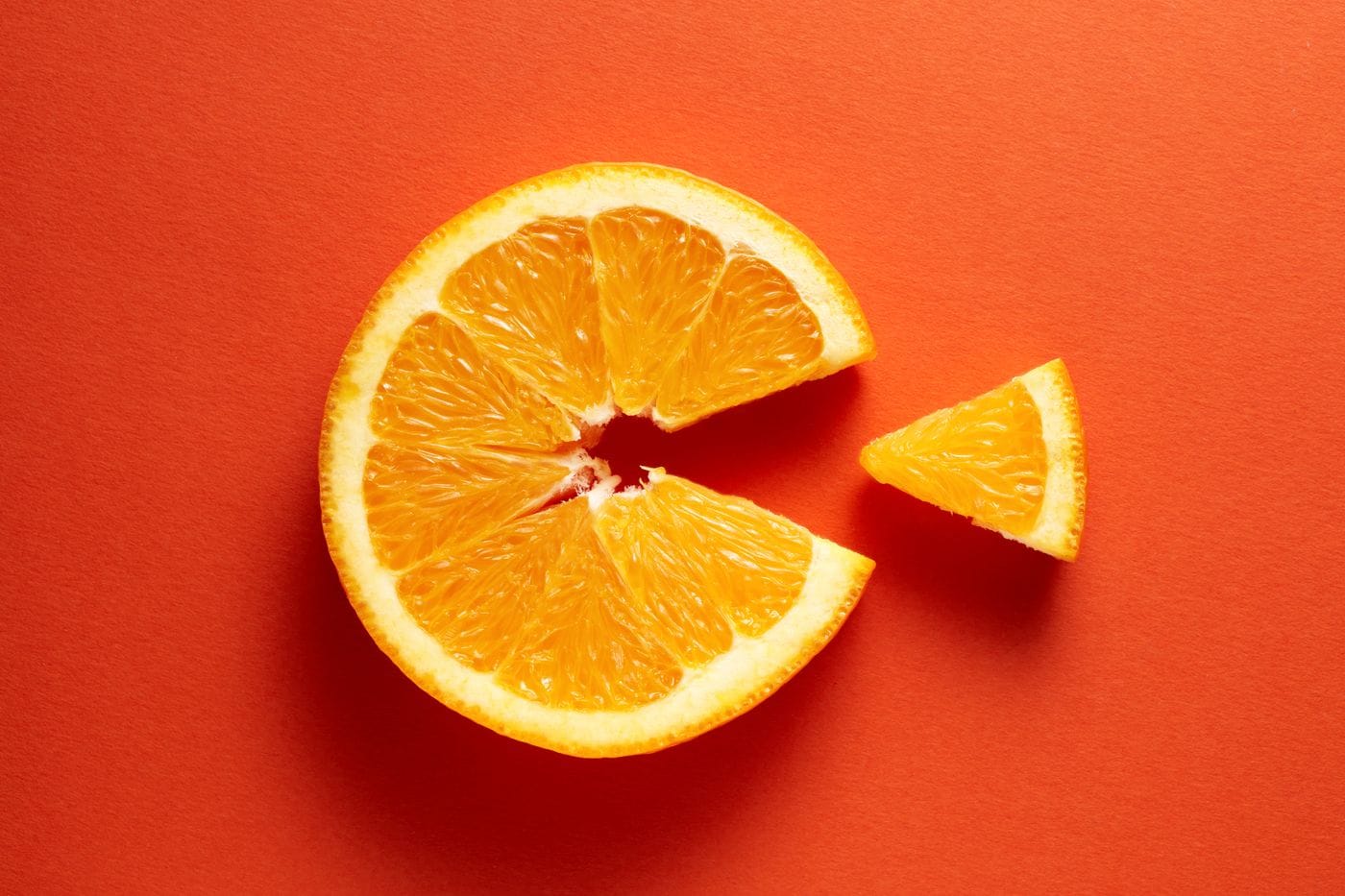 Brain MRI scan alongside fresh citrus fruit representing the Hirosaki University PLOS One study of 2044 older Japanese adults showing higher vitamin C levels are associated with greater gray matter volume and stronger default mode network connectivity