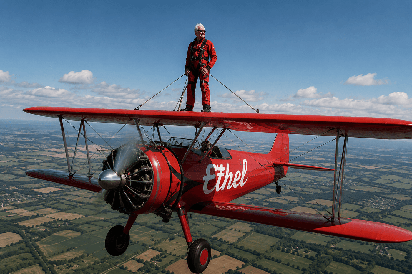 Harry Heasman age 98 strapped to the wing of a 1940s biplane at Duxford Airfield setting the Guinness World Record for oldest wing walker in aid of Lennox Children's Cancer Fund