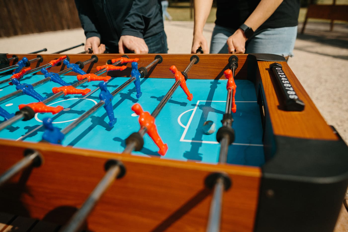 254 participants holding horizontal bars inside a custom-built 150 by 68 foot human foosball arena at Humber Polytechnic in Etobicoke Ontario during the OLG Guinness World Record attempt