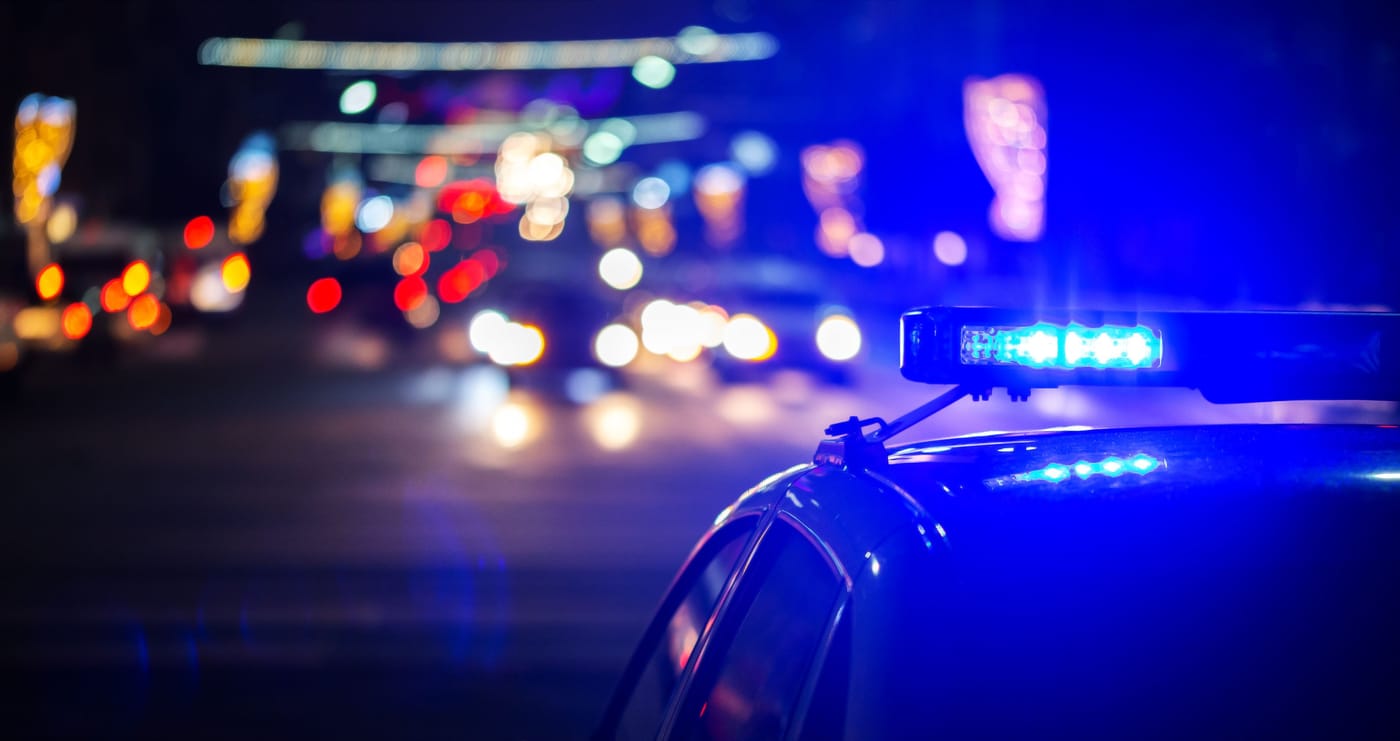 Empty city street at night representing the historic decline in violent crime across American cities in 2025