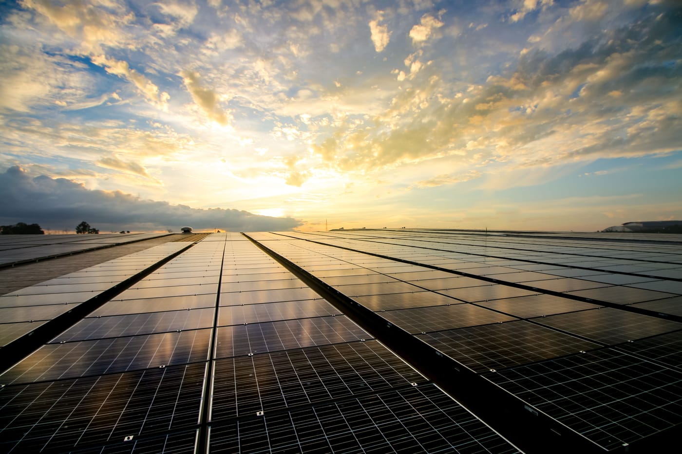 Solar panels on a rooftop against a blue sky representing the Ember analysis showing US solar generation surpassed coal for the first time ever in May 2026